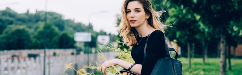 Young woman outdoor serene confident